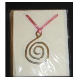 pink ribbon necklace with silver swirl