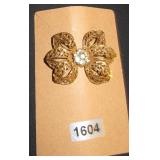 gold flower with clear gems