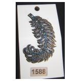 long leaf with blue gemstones