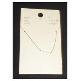 a new day silver chain with a bar pendent