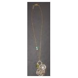 necklace with gold flowers and crystal pendents