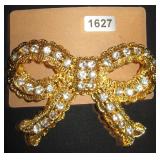 gold bow with clear gems