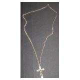 silver chain with a black cross