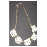 silverchain with 5 bluish flowers in front