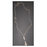 long silver chain with balls and tassel