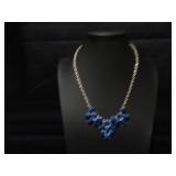 Silver tone necklace with blue beads