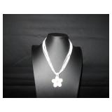 White seed beads with a shell flower pendent