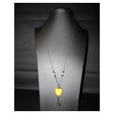 Orange enameled heart on a rope