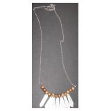 silver chain with wooden beads and mesh pieces