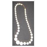 white beeads with gold accents