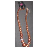 Brown faux pearl necklace and matching earrings