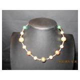 Chocker with silver, bronze, green and gold beads
