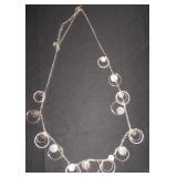 Long silver chain with circles inside circles