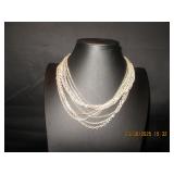Multi strand silver tone necklace
