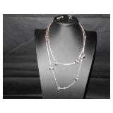 Long chain with black beads matching earrings