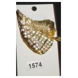 gold leaf brooch with gemstones