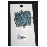 Square brooch with blue gems