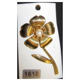 gold flower with pearl center brooch