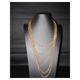 6 chains make up this nice gold tone necklace