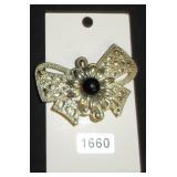 bow brooch with black bead