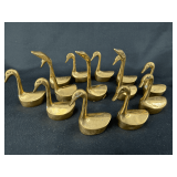 Collection of Thirteen Brass Swan Figurines
