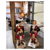 two figurines, one broken