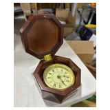 clock in a wooden box