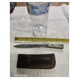 Damascus steel pocket knife with leather case