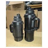 Two large thermos by mana