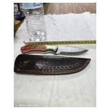 Damascus steel knife with leather case