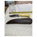 Damascus steel knife with leather sheath