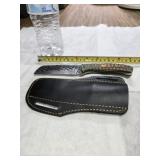Damascus steel, full shank knife with leather.