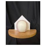 Softball bookend, made from real softball and wood