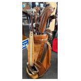 Vintage Spalding and other golf clubs with bag