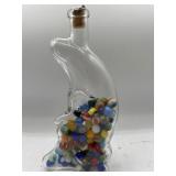 Crescent moon bottle with marbles