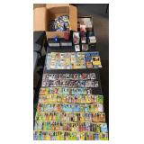 Pokï¿½mon and sports cards with book