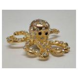 Goldtone Octopus broach with rhinestones