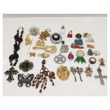 Group of fashion jewelry - pendants, pins & rings