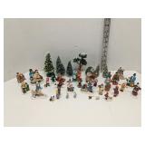 Group of Christmas Village people and trees