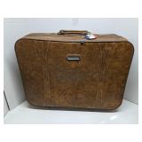 Brown American Tourister luggage piece