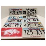 Group of license plates, mostly Arkansas