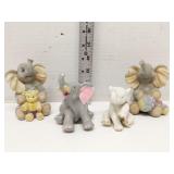 Lot of 4 elephant figures sitting