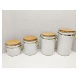 Set of 4 white cannisters with wood lids