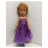 Vintage made in England doll in purple dress