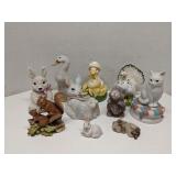 Group of animal figurines: cats, birds, rabbits