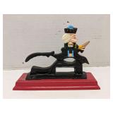 Cast iron nut cracker on wood base
