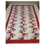 Well loved vintage quilt, fan pattern