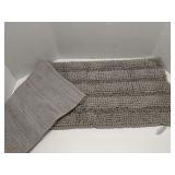 Gray fuzzy floor mat, looks new