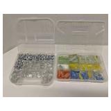 Group of decorative glass beads in storage bins