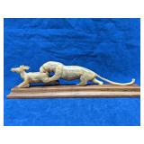 Carved tiger attacking figure